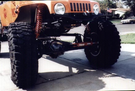 1990 Ford Bronco - This heavily modified Jeep Wrangler features oversized tires and an extreme suspension lift.