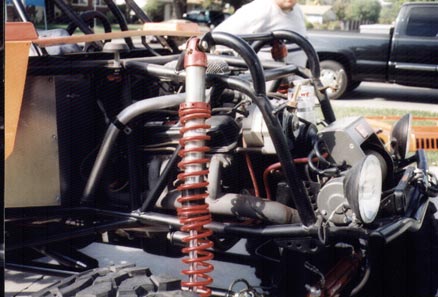 1990 Ford Bronco - This custom buggy features a roll cage and exposed engine components.