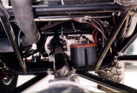 1990 Ford Bronco - The complex undercarriage of a modified vehicle reveals its engine and suspension systems.