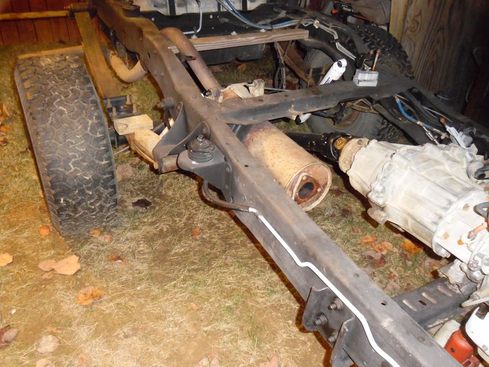 Vehicle frame with transmission and exhaust system components visible