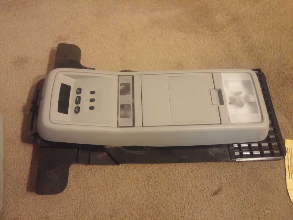 Gray overhead console with trip-computer display and map lights