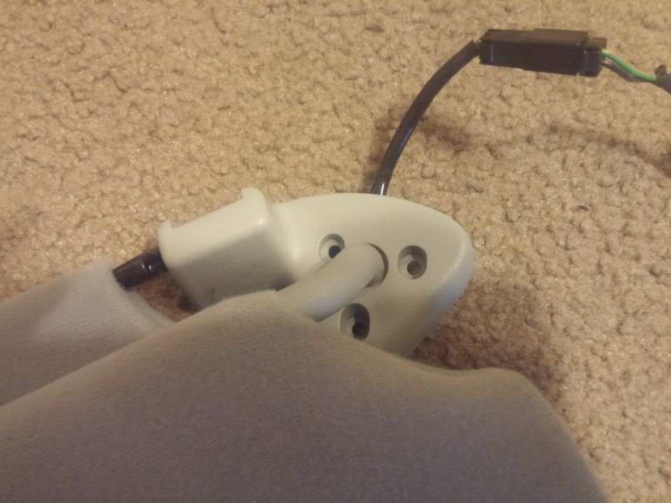 White interior mounting bracket with attached wiring connector