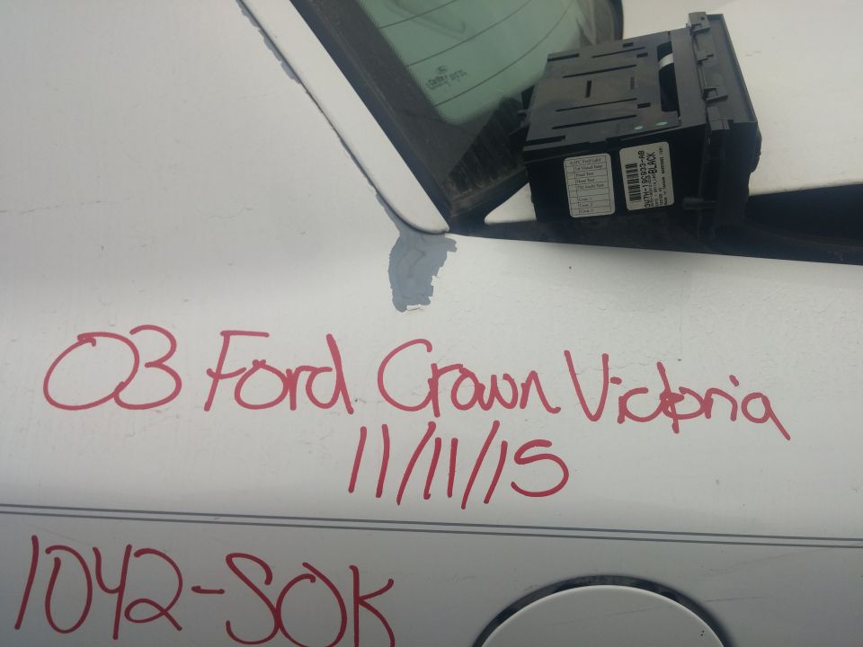 Climate module held by car body with handwritten panel notes