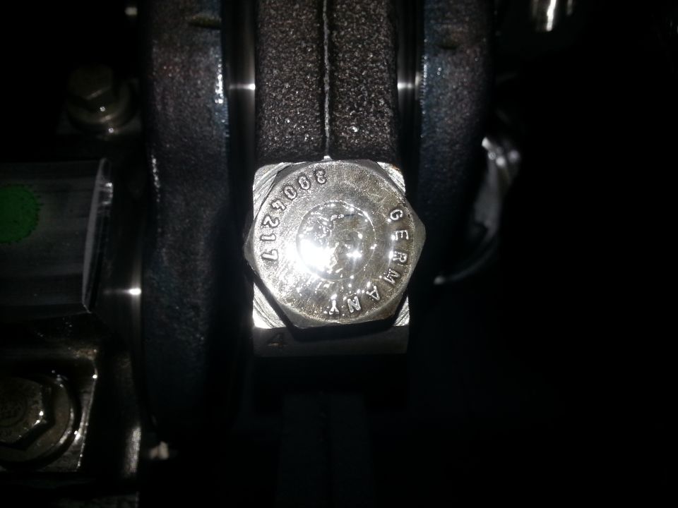 Bolt head with text 3005217 GERMANY