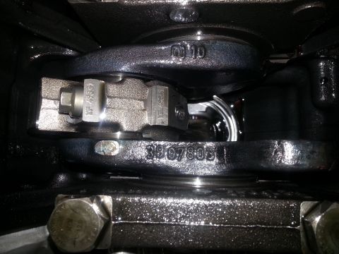 1994 Ford Bronco - A close-up view of internal engine components, likely a crankshaft and connecting rod assembly. Visible stamped numbers include "01 10" and…