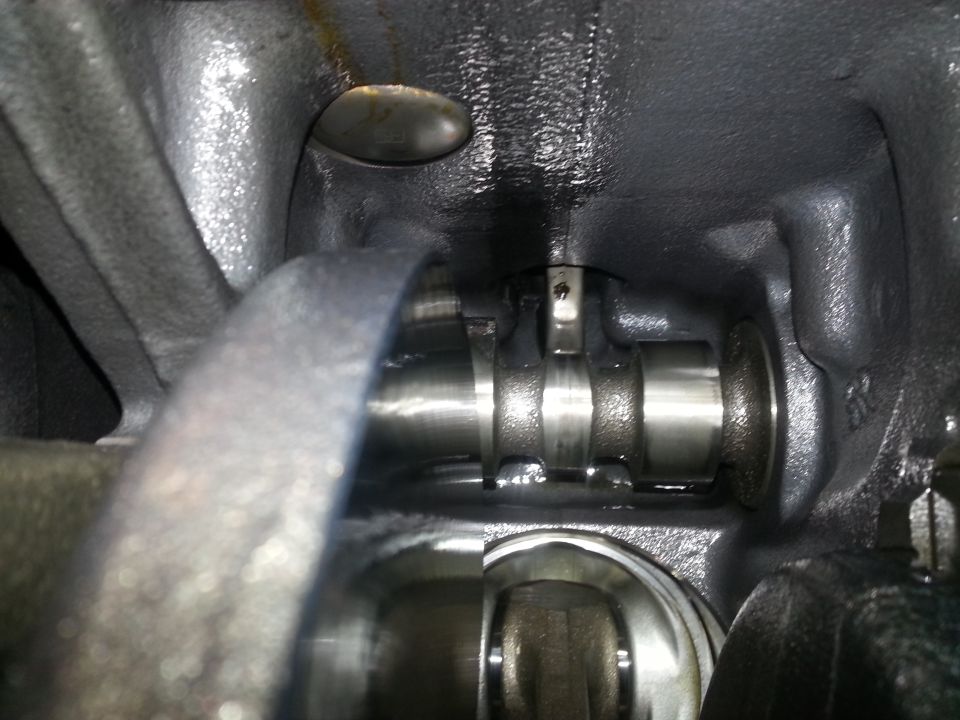Close-up of engine internal components, showing a camshaft.