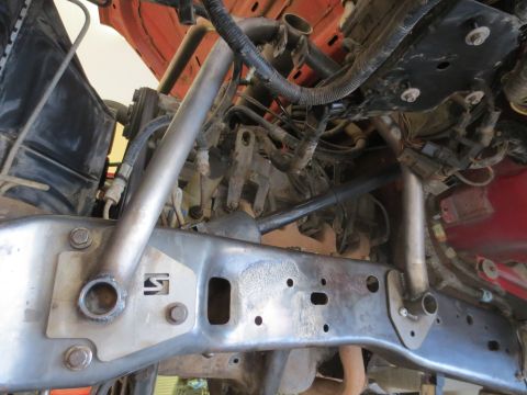 1996 Ford Bronco - Close-up view of a vehicle's undercarriage, showing the frame and engine bay details.