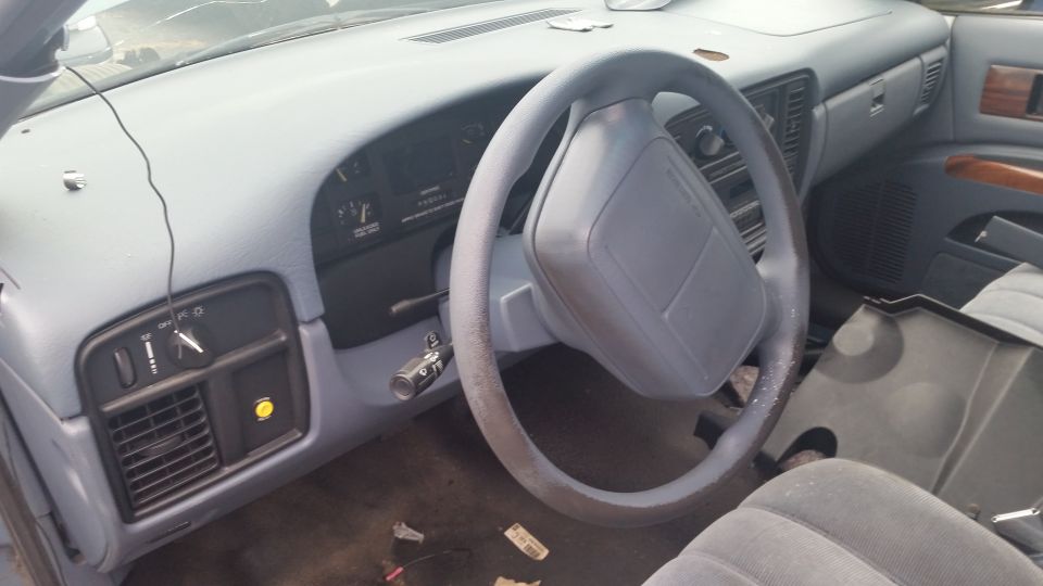 Interior dashboard and steering wheel of a sedan