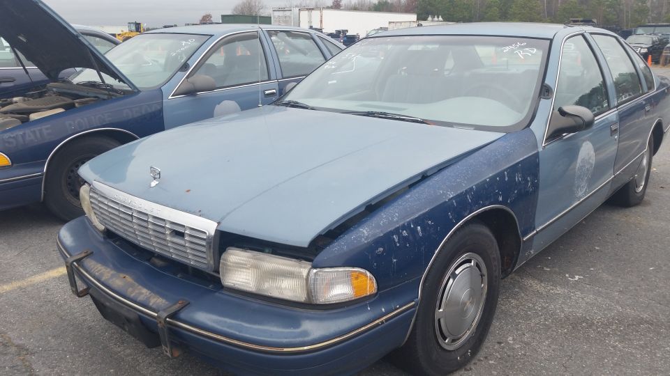 Front view of a two-tone blue Chevrolet Caprice sedan