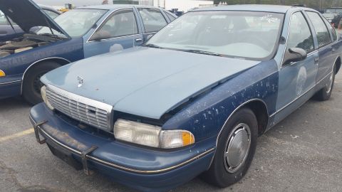 1991 Ford LTD Crown Victoria - Photograph of a two-tone blue Chevrolet Caprice from the front, not a technical document.