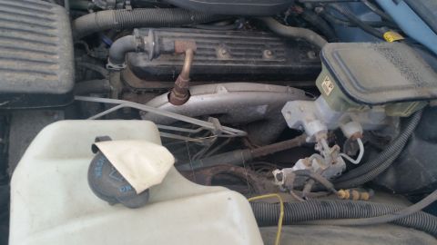 1991 Ford LTD Crown Victoria - Photograph of a Caprice engine bay detail, not a technical document.