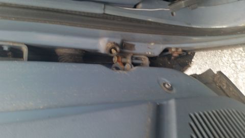 1991 Ford LTD Crown Victoria - Photograph of a Caprice door hinge area, not a technical document.