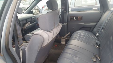 1991 Ford LTD Crown Victoria - Photograph of the Caprice rear interior and bench seat, not a technical document.