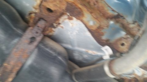 1991 Ford LTD Crown Victoria - Photograph of the rusted undercarriage of a Caprice, not a technical document.