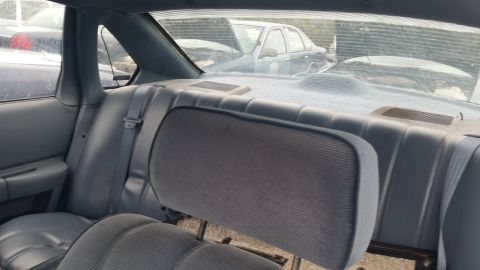 1991 Ford LTD Crown Victoria - Photograph of a vehicle's rear interior and seat, not a technical document.