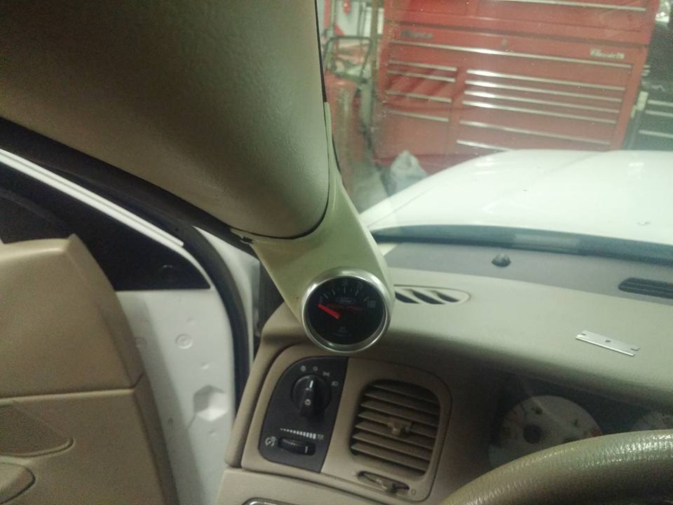 A-pillar mounted gauge pod and dashboard vents in a vehicle