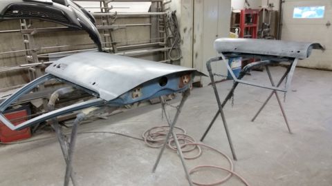 2001 Ford Crown Victoria - Photograph of vehicle body panels on stands during restoration, not a technical document.