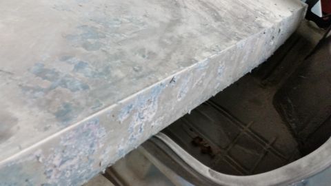 2001 Ford Crown Victoria - Photo of a sanded sheet-metal panel during bodywork, not a technical document.