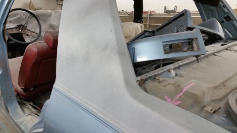 2001 Ford Crown Victoria - Restoration photo of a primered sedan interior, not a document.