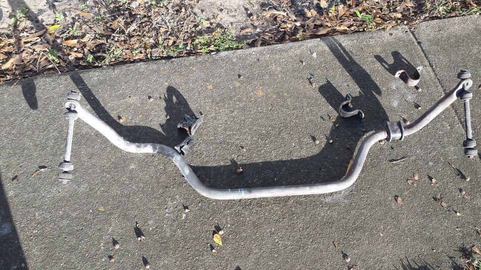 Sway bar assembly with end links and brackets on concrete