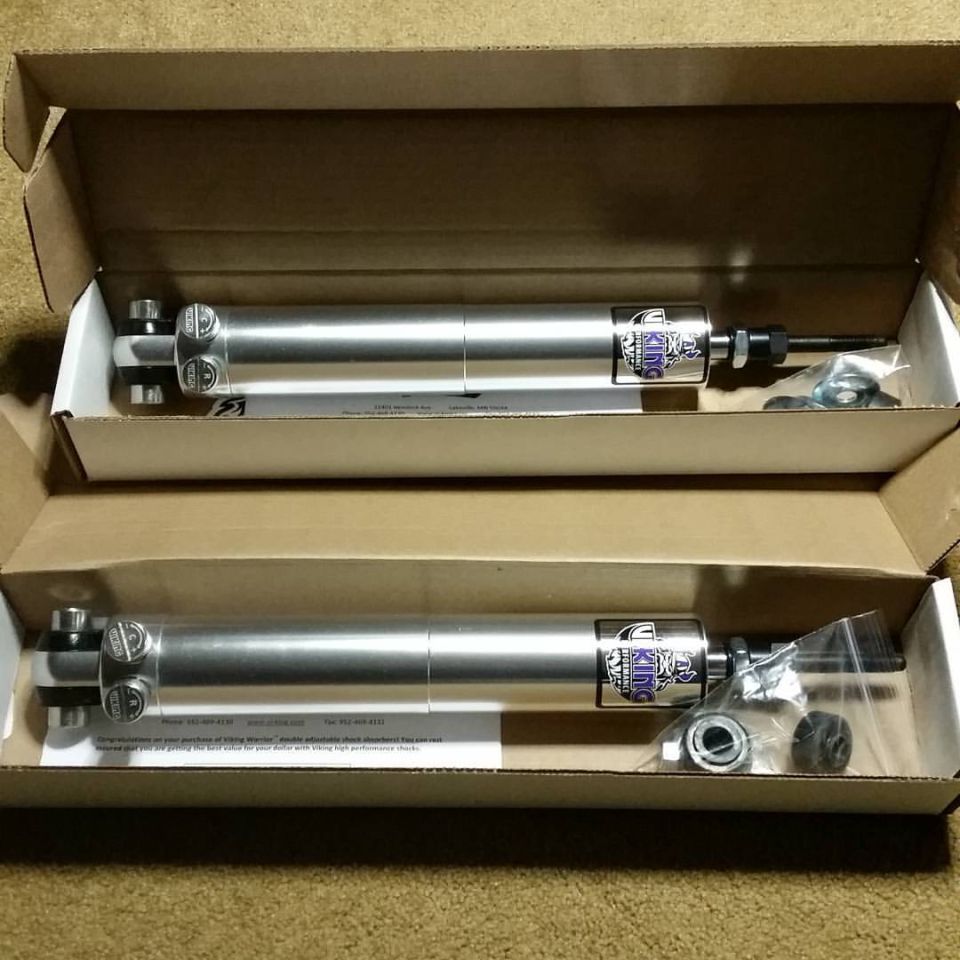 Two aluminum Viking double-adjustable shock absorbers in boxes