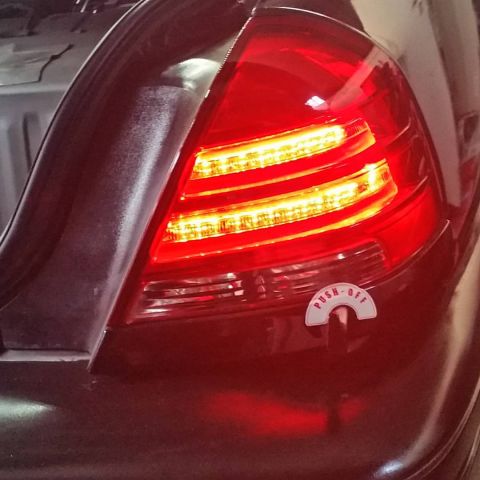 2003 Ford Crown Victoria - Photograph of an aftermarket LED tail light installed on a car, not a technical document.