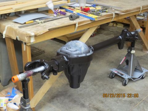 1986 Ford Bronco - Dana 60 shot with epoxy base coat. Also notice my poor man rollers. the pipe makes it nice to move it around while painting.