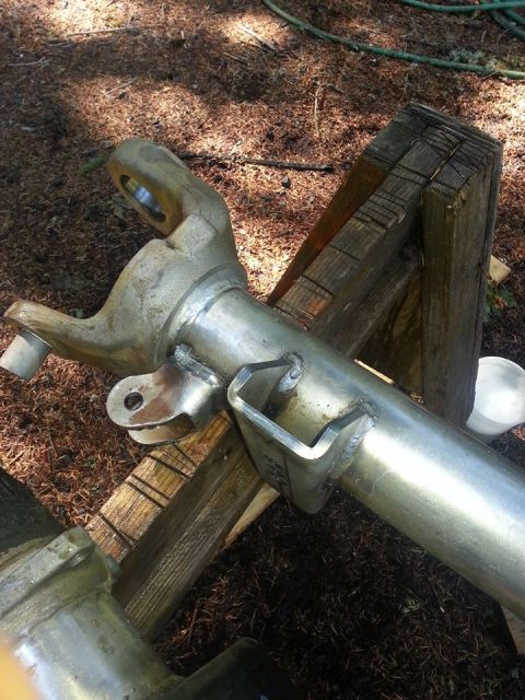 1986 Ford Bronco - new spring pad and shock tabs welded on. I'm impressed with the welding down there at custom machine.