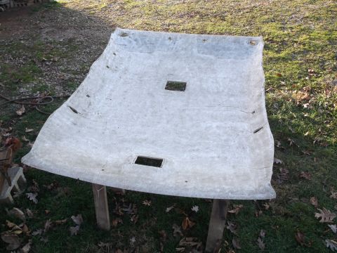 1999 Mercury Grand Marquis - A light-colored car headliner is laid out on the grass, supported by two wooden posts. The headliner has several rectangular cutouts and ap…