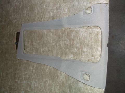 1999 Mercury Grand Marquis - A light gray interior trim piece with a large rectangular cutout is shown. The trim piece has two small circular cutouts near the top and b…