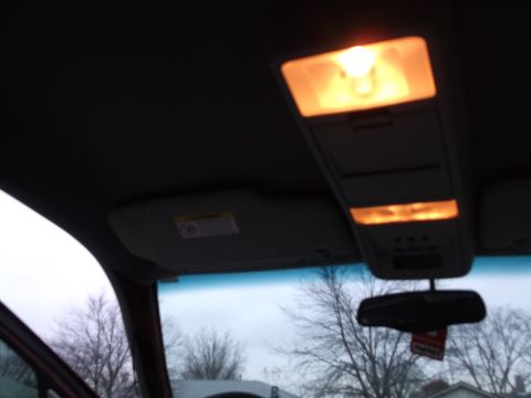 1999 Mercury Grand Marquis - Interior view of the overhead console and illuminated lights in a 1999 Mercury Grand Marquis.