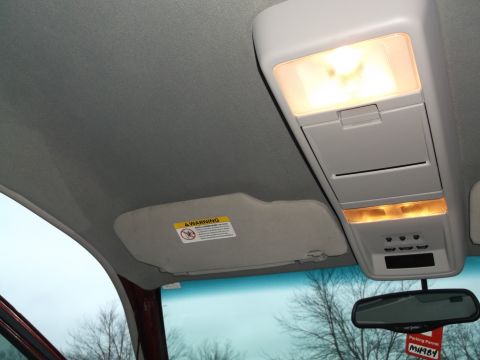 1999 Mercury Grand Marquis - The overhead console and sun visor are visible inside the vehicle.