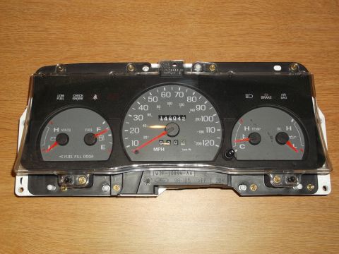 1999 Mercury Grand Marquis - Instrument cluster gauge assembly with odometer showing 146042 miles.