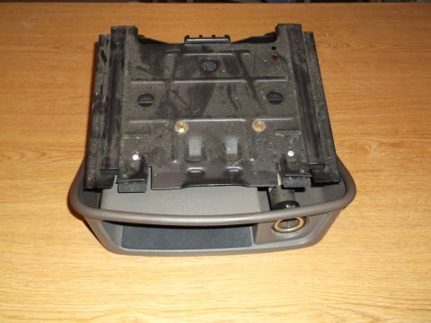 1999 Mercury Grand Marquis - This is a close-up, overhead view of a car's center console ash tray and cigarette lighter assembly, likely from a 1999 Mercury Grand Marqu…