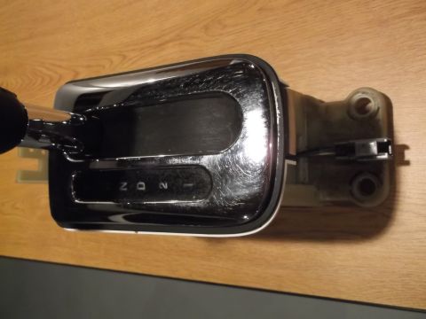 1999 Mercury Grand Marquis - A close-up, high-angle shot shows a chrome and black automatic transmission shifter assembly with visible gear indicators for P, R, N, D, 2…
