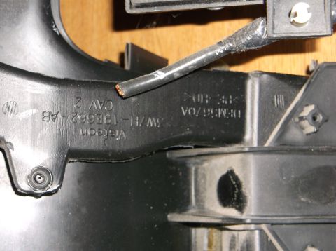 1999 Mercury Grand Marquis - Close-up view of black plastic automotive part with embossed text. Visible text includes "Visteon", "3W7H-19E662-AB", "CAV 2", and "DFM5670…