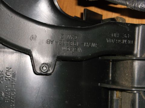 1999 Mercury Grand Marquis - Black plastic part with embossed text that includes part numbers and manufacturer information. Visible text includes 'Visteon', '3W7H-19E66…