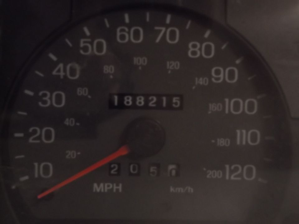 Odometer and speedometer of a 1999 Mercury Grand Marquis. Odometer reads 188215.