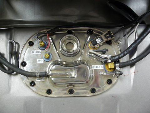 Fuel pump sending unit with labels BLACK, RED, VENT, RETURN, and fuel lines.