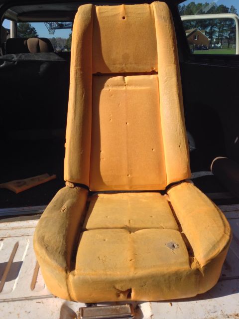 1979 Ford Bronco - A tan car seat, possibly from a 1970s vehicle, is shown outdoors.