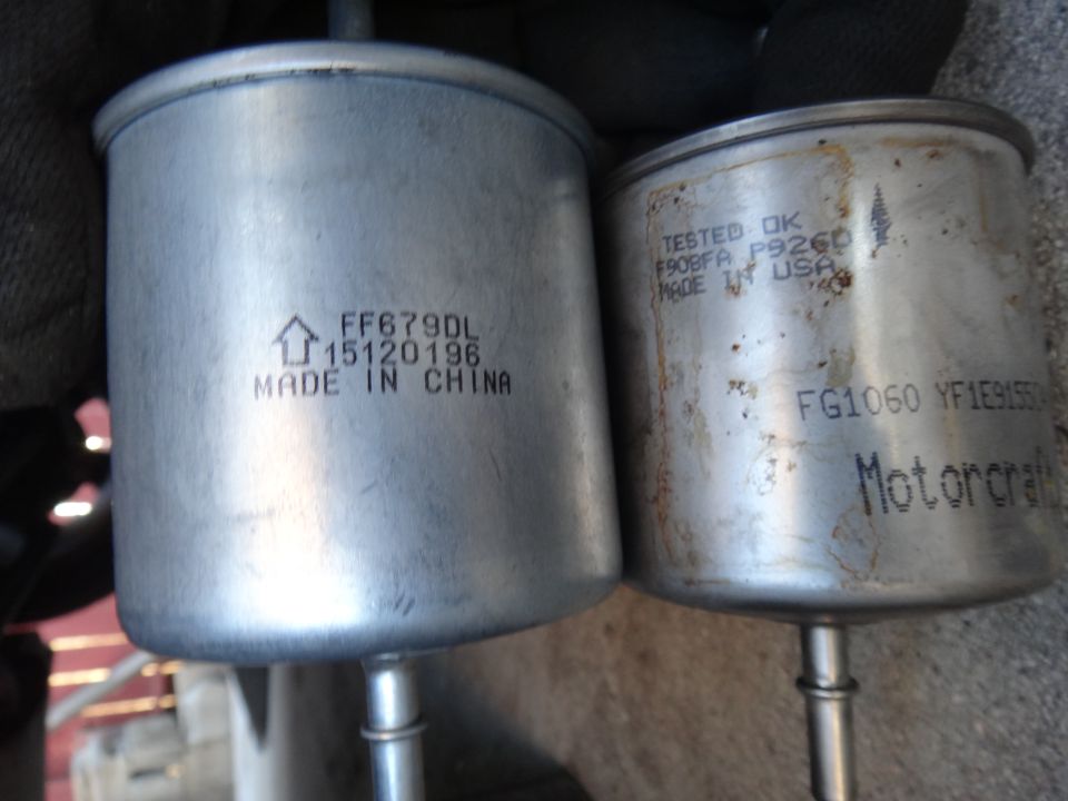 Two fuel filters, one labeled "MADE IN CHINA" and the other "MADE IN USA" and "Motorcraft".