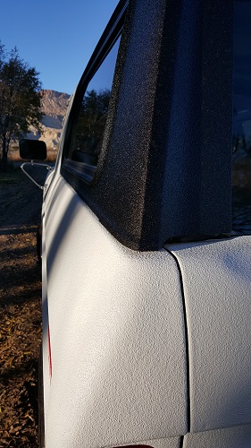 1978 Ford Bronco - Truck bed with spray-on liner, showing the side panel and rear corner detail.