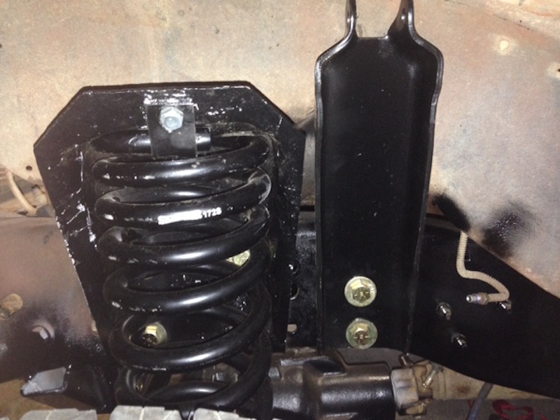 Black coil spring with visible part number 31725 and suspension bracket