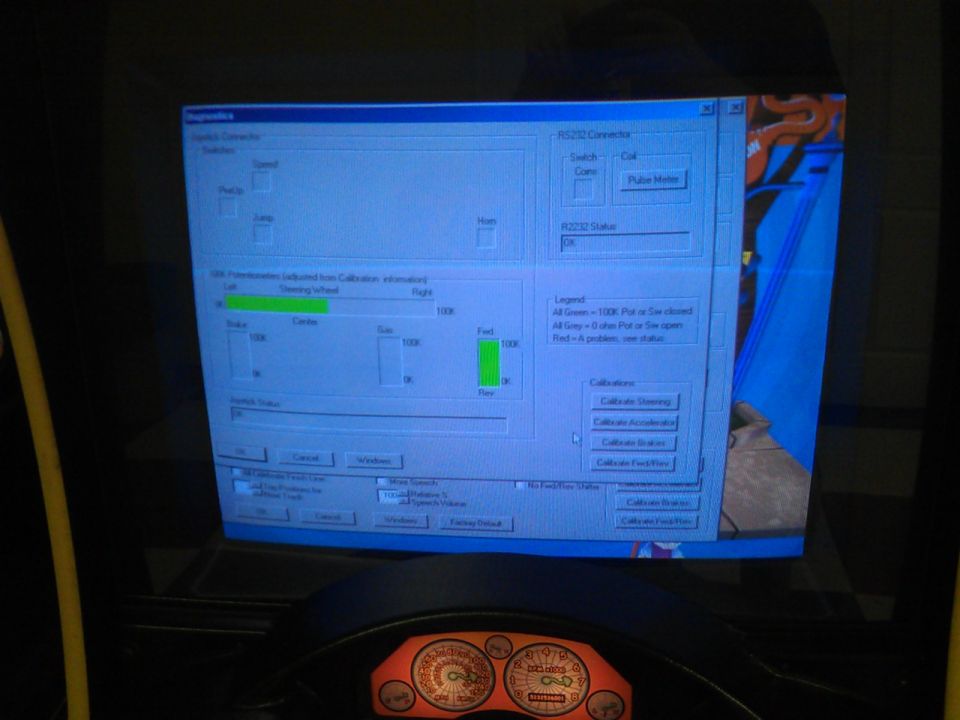 Computer screen shows calibration software with steering wheel and pedal inputs