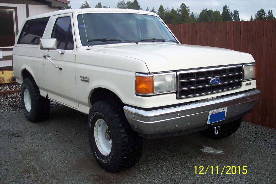 White 1990 Ford Bronco 3/4 front view with aftermarket wheels