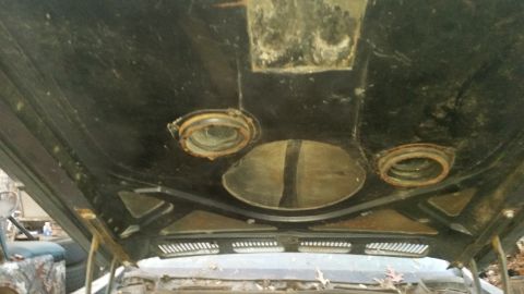 1970 Pontiac Firebird - View of the underside of a car's hood, revealing its internal structure and mounting points.
