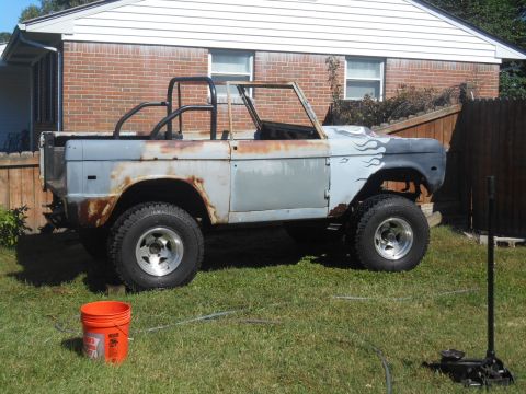 1972 Ford Bronco - This 1972 Ford Bronco is undergoing restoration, with visible rust and primer paint.