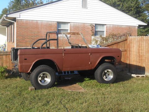 1972 Ford Bronco - This 1972 Ford Bronco is undergoing restoration, showing its classic side profile with a roll cage installed.