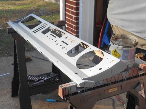1972 Ford Bronco - A gray dashboard panel, likely for a classic vehicle, is shown disassembled and supported by sawhorses.