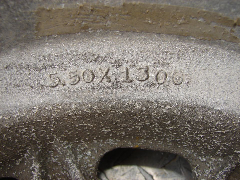 Close-up of a wheel showing "5.50X1300" stamped into the metal